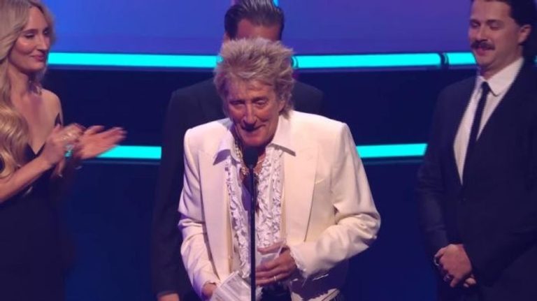 Sir Rod Stewart, 80, joined by children in rare public appearance after cancelling string of gigs due to illness